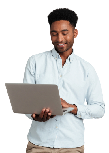 Young smiling man using laptop